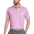 A man wears a FootJoy Men’s Citrus Print Lisle Polo in Lemonade/Skyway, gray pants, and a gray belt with a white buckle, standing with his hands relaxed at his sides.