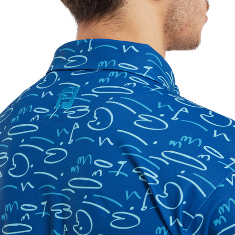 A close-up of a person wearing the FootJoy Men's Golf Course Doodle Polo in Deep Blue, showcasing abstract and cursive patterns on the back and collar. Only the lower half of their face is visible.