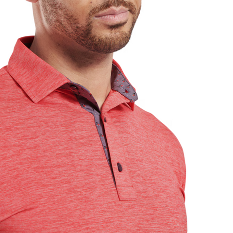A man models the FootJoy Men's Heather Lisle Polo in Hibiscus, featuring a contrasting patterned inner collar. The cropped photo shows just his lower face, neck, and upper chest in this stylish, lightweight stretch polo by FootJoy.