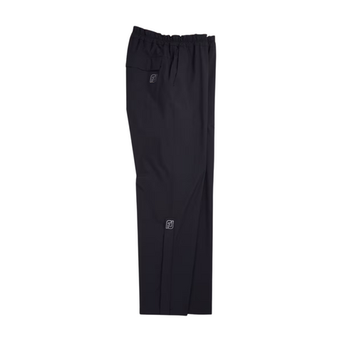 FootJoy Men’s HydroLite X Rain Pants in black with an elastic waistband and small logo patches on the thigh and lower leg are shown flat on a white background. These FootJoy trousers offer reliable waterproof protection for golfers.