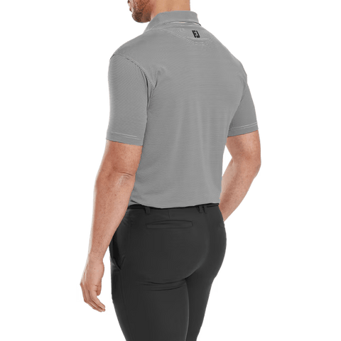 A man, seen from behind, wears a FootJoy Mens Micro Feeder Stripe Lisle Polo in Black/Grey with black pants. The background is transparent.