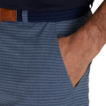 A close-up shows a hand in the pocket of FootJoy Mens Performance Lightweight Short, blue striped with a braided navy belt and brown leather accent, highlighting the moisture-wicking comfort from FootJoy.