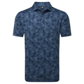 The FootJoy Men's Pop Camo Lisle Polo in Dark Denim is a short-sleeved, moisture-wicking golf polo with a blue camo pattern, collared design, button placket, and FJ logo on the left collar.