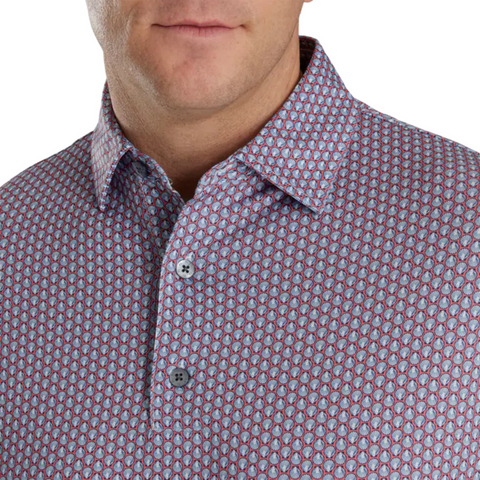 A man wears a FootJoy Mens' Scallop Shell Foulard Lisle Polo in coral red; only the lower half of his face and upper torso are visible.