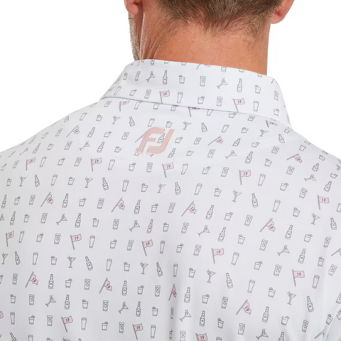 A close-up of the FootJoy Men's The 19th Hole Lisle Polo in white shows lightweight fabric with a light pink pattern of golf flags, martini glasses, and drink icons. The FJ logo is placed under the collar.
