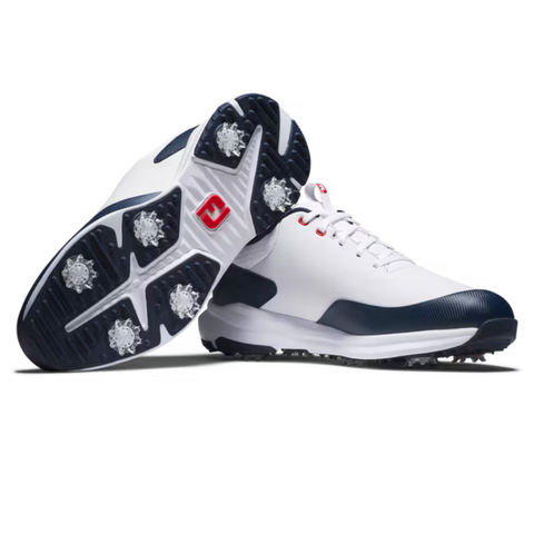 A pair of FootJoy Men’s Tour Rival Golf Shoes in white with navy accents and red logos, featuring spiked soles for grip. One shoe stands upright, the other lies sideways to showcase the sole’s design. Brand: FootJoy.