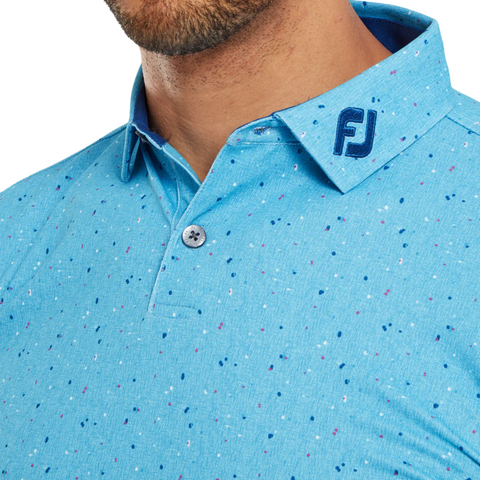 A close-up of a person wearing the FootJoy Men's Tweed Texture Polo by FootJoy in Blue Sky, a performance golf polo with a buttoned collar and a dark blue FJ logo embroidered on the collar.