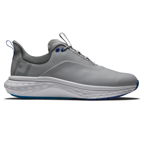 The FootJoy Quantum Men’s Golf Shoes feature a gray upper with white cushioned sole, blue accents on the lace holes and outsole, a heel loop, subtle logo, and mixed materials for all-day comfort inspired by classic spikeless golf shoe design.