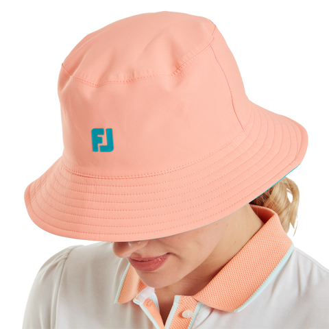 FootJoy Reversible Bucket Hat Teal/Peach – Peach side worn view