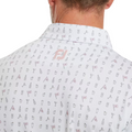 A close-up of the back of a FootJoy The 19th Hole Lisle Mens Polo, a white golf shirt with martini glass, can, and FJ logo patterns. The person’s head is turned, revealing only the neck and part of the jaw. Brand: FootJoy.