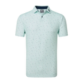 FootJoy Tweed Texture Polo in light mint green. The polo features a subtle tweed-like pattern with small specks of darker colors throughout the fabric. It has a classic button-up collar and short sleeves, with the FootJoy logo on the inside of the collar.