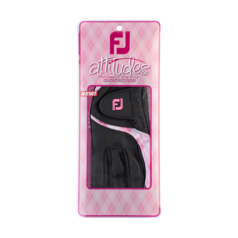 A packaged FootJoy Women’s Attitudes Glove with pink accents and FootJoy branding is shown against a pink plaid background. The packaging features Attitudes, NEW! and highlights this stylish women’s golf glove.
