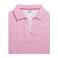 The FootJoy Women’s Cap Sleeve Print Shirt in Pink Lemonade features an abstract dotted pattern, moisture-wicking fabric, short sleeves, and an FJ logo on the inside collar, shown folded against a white background.