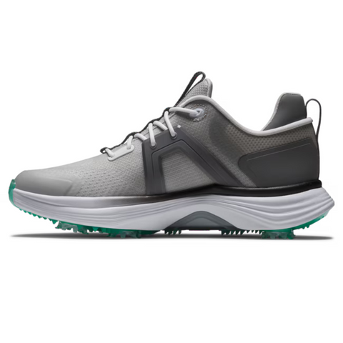 The FootJoy Women's Hyperflex Golf Shoes in Grey/Teal feature black accents, a white midsole, teal-tipped outsole, and white laces. These lightweight, breathable golf shoes are shown in side profile on a white background.