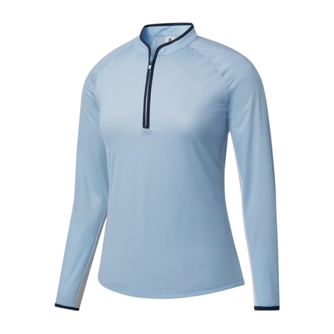 The FootJoy Women’s Long Sleeve Sun Protection Shirt in Skyway/Navy features a fitted design with dark navy trim on the collar and cuffs, a quarter-zip front with a dark zipper, and is shown on a white background.