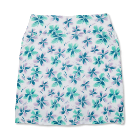 The FootJoy Women's Performance Knit Skort features a white base with teal, blue, and purple floral patterns, moisture-wicking fabric, a wide waistband, and a blue FootJoy logo at the bottom right.