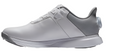 A side view of the FootJoy Women’s ProLite BOA Golf Shoes in White/Grey, showcasing a sleek design, textured heel, and BOA Fit System dial on a white background. Ideal for golfers seeking lightweight, modern footwear.