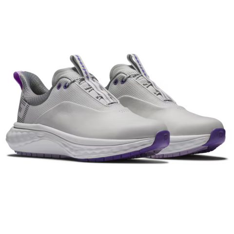 A pair of FootJoy Women's Quantum Golf Shoes in grey, white, and purple with OrthoLite FitBed cushioning for comfort. These spikeless shoes by FootJoy are showcased against a plain white background.