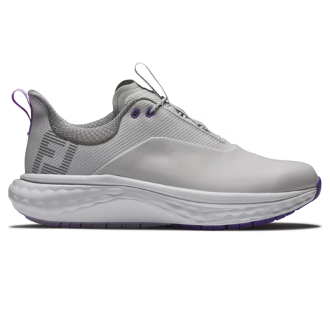 The FootJoy Women's Quantum Golf Shoes in Grey/White/Purple feature OrthoLite FitBed cushioning, gray mesh accents, purple eyelets and pull tab, a stylized F logo on the heel, and a spikeless design for stylish comfort.