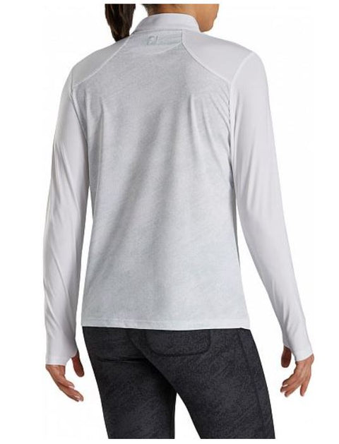A woman with her hair in a ponytail is seen from behind wearing the FootJoy Women's Sun Protection Long Sleeve Shirt in white.