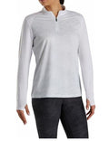 A person wearing the FootJoy Women's Sun Protection Long Sleeve Shirt in white stands with arms slightly out to the sides against a plain background.