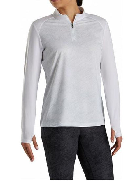 A person wearing the FootJoy Women's Sun Protection Long Sleeve Shirt in white stands with arms slightly out to the sides against a plain background.