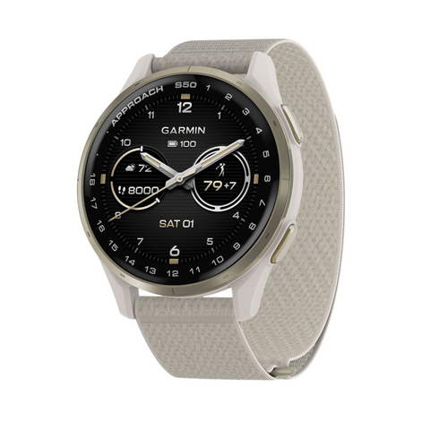 A Garmin Approach S50 GPS watch with a round black face showing multiple fitness metrics and date, set in a light-colored bezel with a textured beige band. Brand: Garmin.