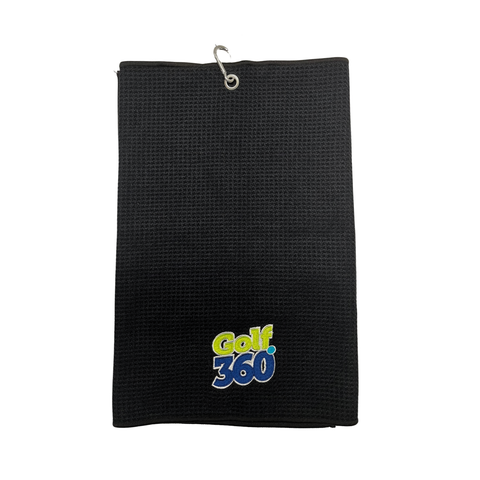 The Sporte Leisure Golf 360 Waffle Golf Towel is a black, fast-drying towel with a metal hook and the embroidered Golf 360 logo in yellow, blue, and white near the bottom center—combining style and function.