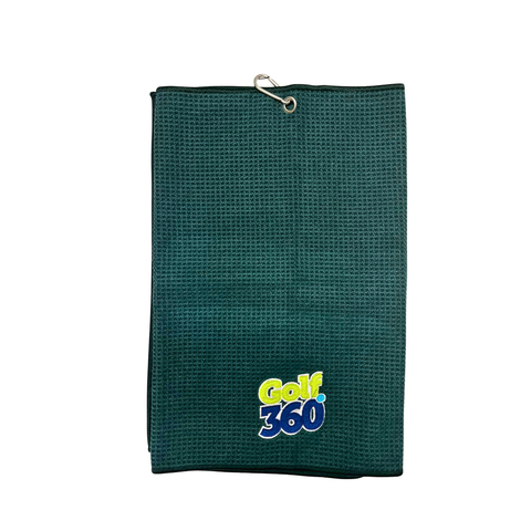The Sporte Leisure Golf 360 Waffle Golf Towel is dark green with a metal grommet and hook, and features the Golf 360 logo in yellow, white, and blue at the bottom center. The background is white.