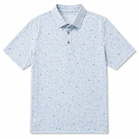 Greg Norman men's golf polo with pale blue and white abstract print and small navy motifs, front view