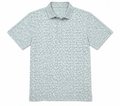 Greg Norman men's golf polo with mint, aqua and navy starburst print, front view