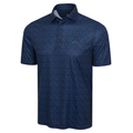 The Greg Norman Men's ML75 Club House Print Polo in navy features short sleeves, a subtle geometric pattern, collar with three buttons, moisture-wicking recycled ML75 fabric, and a colorful left chest logo.