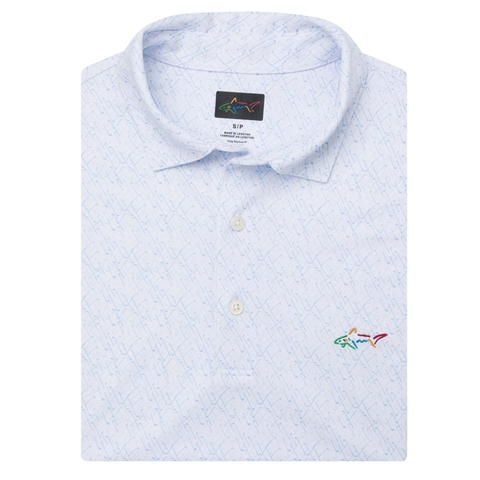 The Greg Norman Men's ML75 Club House Print Polo in white features a subtle print, three-button placket, moisture-wicking fabric, and an embroidered multicolored shark logo on the chest.