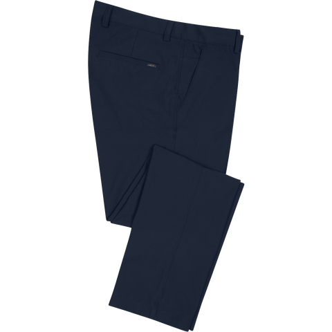 Greg Norman men's ML75 Microlux golf pants in navy — folded view showing pocket and fabric detail.