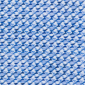 Close-up of the light blue and navy shark-tail print on the Greg Norman Shark Tail Matrix golf polo.