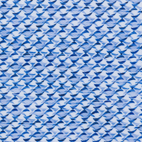 Close-up of the light blue and navy shark-tail print on the Greg Norman Shark Tail Matrix golf polo.