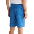 Greg Norman Tonal Palm Leaves shorts in maritime blue, shown on a model from the back, featuring a subtle palm leaf pattern and back pockets.