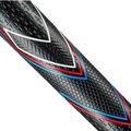 Close-up of a black cricket bat handle featuring the JumboMax JMX UltraLite Grip by JumboMax, showcasing its oversized textured golf grip and geometric red, blue, and white patterns.