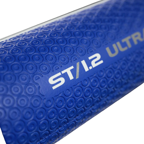 Close-up of the JumboMax ST/1.2 Jumbo Putter Grip in blue/black, featuring textured circular patterns and silver "ST/1.2 ULTRA" text—reflecting the stability and control this JumboMax grip brings to your putting stroke.