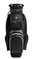 The MGI 2024 Dri Play Cart Bag, in black, features multiple zippered compartments, the MGI logo on the front pocket, and a lightweight waterproof design. It stands upright against a white background.