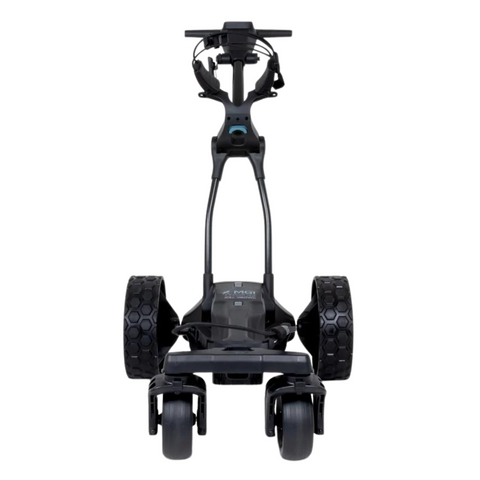 Front view of the MGI Ai Navigator GPS+ Electric Golf Trundler by MGI, featuring large textured rear wheels, two small front wheels, and a handlebar at the top for steering.
