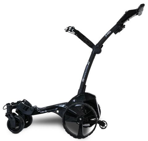 The MGI Zip Navigator All Terrain Electric Golf Trundler, in sleek black with all-terrain wheels and adjustable handle, is displayed against a white background; includes a free accessory pack.
