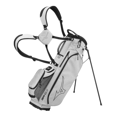 The Mizuno 2024 BR-D3 Stand Bag features a light gray design with black accents, multiple zippered pockets, dual shoulder straps, and a bold logo. Two extended legs make this lightweight golf bag easy to access and carry.