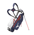 View of the white and navy Mizuno BR-DRI WP Stand Bag fully extended using the stand and with the shoulder straps clearly shown