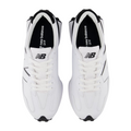 A top view of New Balance 327 Womens Golf Shoes - White/Black shows the spikeless design, black detailing, white laces, and New Balance logos on the tongues. The retro shoes are side by side on a plain background.