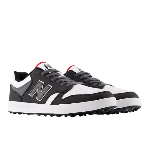 The New Balance 480 Golf SL Mens Golf Shoes in black and white feature gray details, red tongue accents, large side N logos, black soles, and white toe boxes. The shoes are pictured angled to display both their sides and fronts.