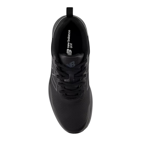 A top view of New Balance Brighton V2 Mens Golf Shoes in Black/Grey shows black laces, a black tongue, and New Balance Golf branding on the insole. These waterproof shoes offer style and comfort for golfers.