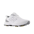 The New Balance Brighton V2 Men's Golf Shoe in white/grey features gray accents, a large N logo, textured sole with yellow spikes for traction, and is waterproof