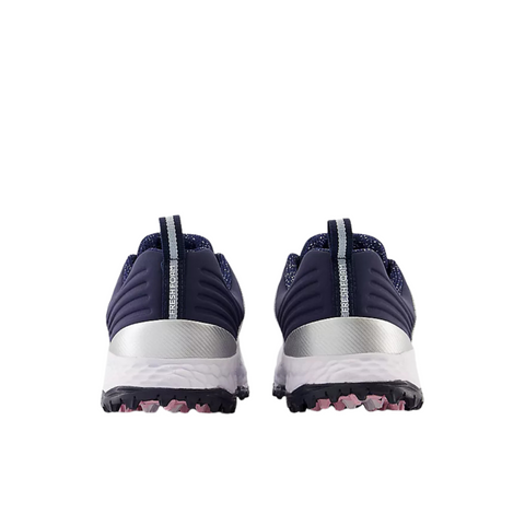 Back view of New Balance Fresh Foam Contend V2 Womens Golf Shoes in white/navy, featuring textured spikeless soles, pink grip accents, vertical heel pull tabs, and lightweight cushioning against a white background.
