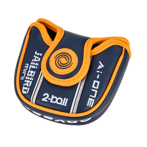 The Odyssey Ai-ONE 2-Ball Jailbird Mini DB Putter headcover by Odyssey features navy and orange colors, Ai-ONE and JAWSpro mini text, a swirl logo on the front flap, and is ideal for compact putter or 2-ball alignment setups.